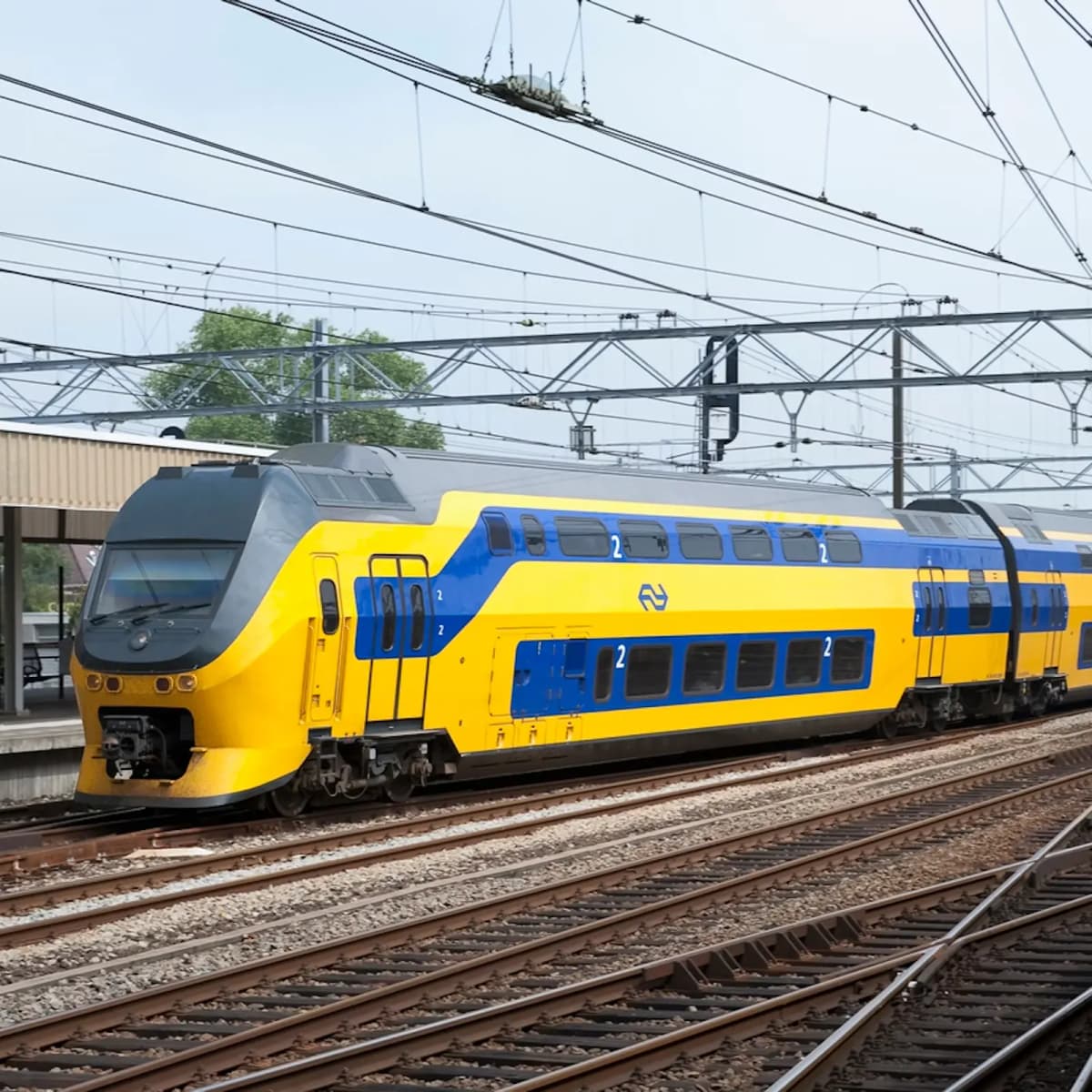 dutch train arriving at station